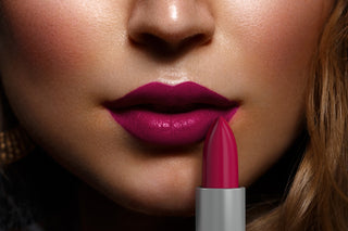 Close-up of lips wearing Mirabella Fiercely Fuchsia Sealed With a Kiss Lipstick, a bold vibrant pink shade with smooth satin finish.