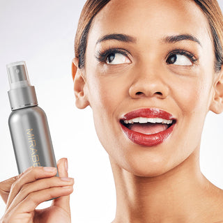 Model using Mirabella Beauty's Bulletproof Matte Finishing Spray, showcasing its matte finish and application on makeup.