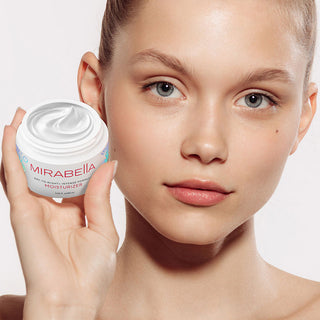 Image of close up Model holding Mirabella Beauty's new Day to Night+ Anti Aging Cream with collagen.