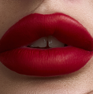 Close-up of bold red matte lips, showcasing Mirabella matte lipstick shades featured in The Lip Edit 30% off promotion.