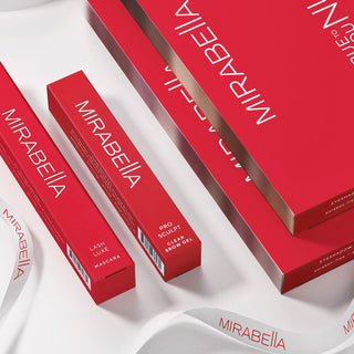 Image of Mirabella Beauty best-selling eyeshadow palettes and brow gel in signature red packaging.