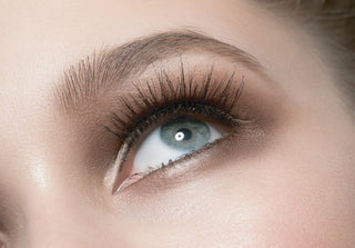 Close up eye with softly defined natural brow shaped using Mirabella brow products for a balanced lifted appearance