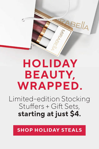 Mobile holiday banner with Mirabella Lip Gloss Trio gift set in a white bag. Text promotes limited-edition stocking stuffers and beauty gift deals starting at $4.