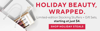 Desktop holiday banner with Mirabella Lip Trio in gift packaging. Highlights limited-edition stocking stuffers and affordable beauty gifts starting at $4.