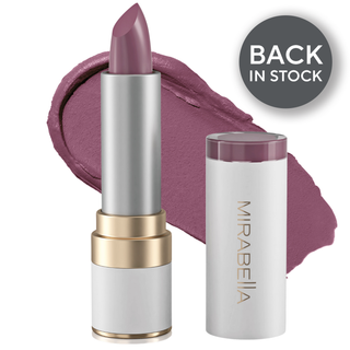 Mirabella's Sealed With A Kiss Lipstick shade Sugar & Spice lipstick tube alongside opened cap & swatch in background.