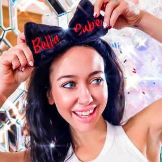 Model using the Plush Mirabella Bella Babe Headband while applying makeup: Pull back for a flawless skincare & makeup 